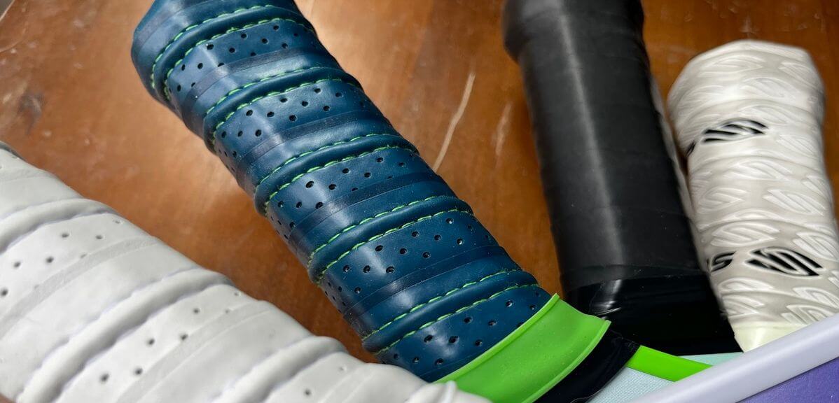 A photo showing lead tape being applied to the 3 and 9 o'clock positions of a pickleball paddle.